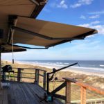 rainier awning installed on a beachfront home