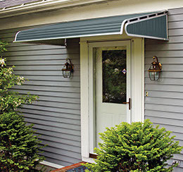 wide green metal awning over a doorway